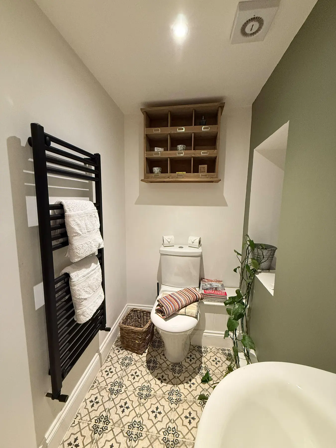 Clean green and white bathroom