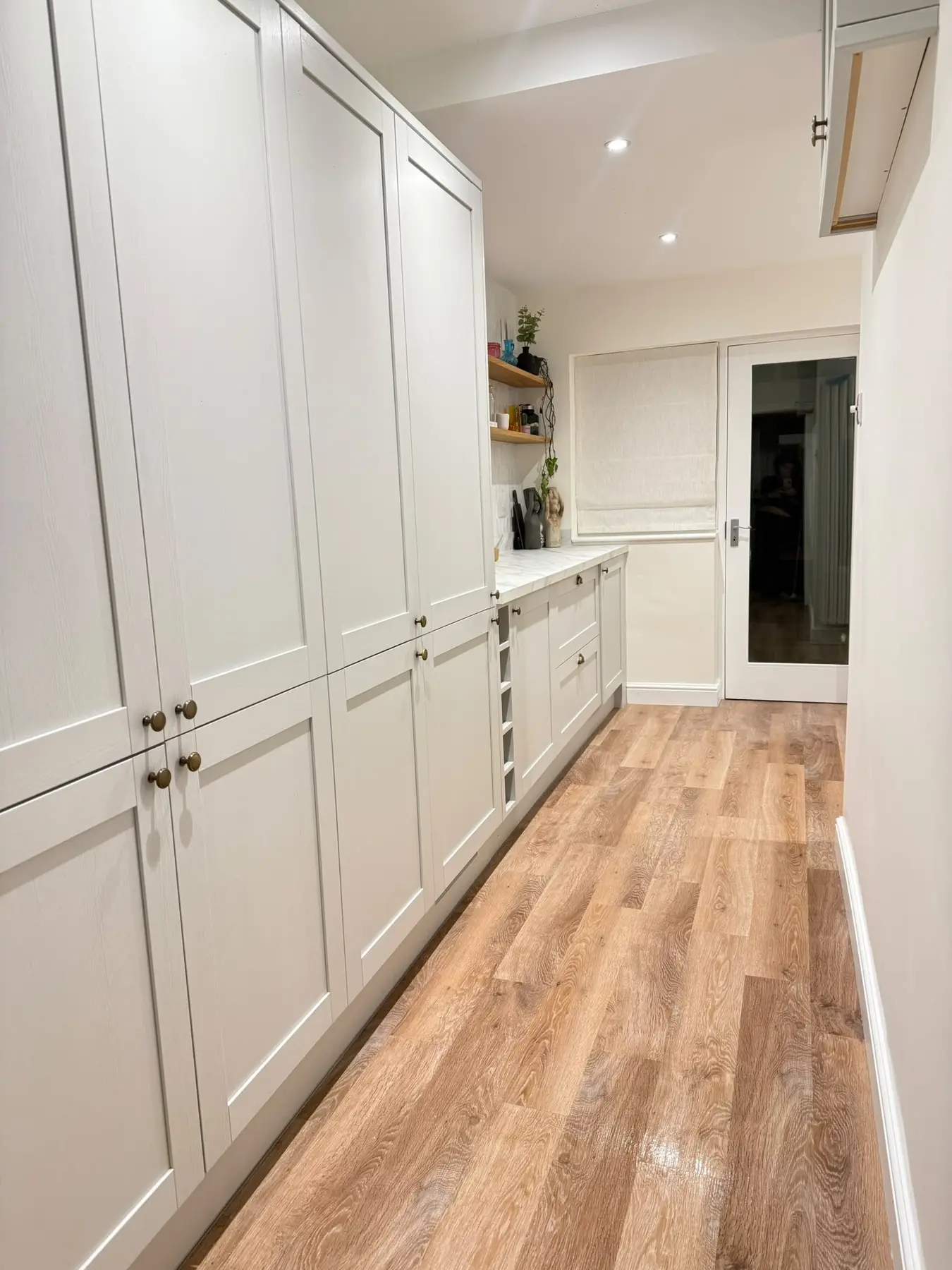 Long fitted kitchen after cleaning