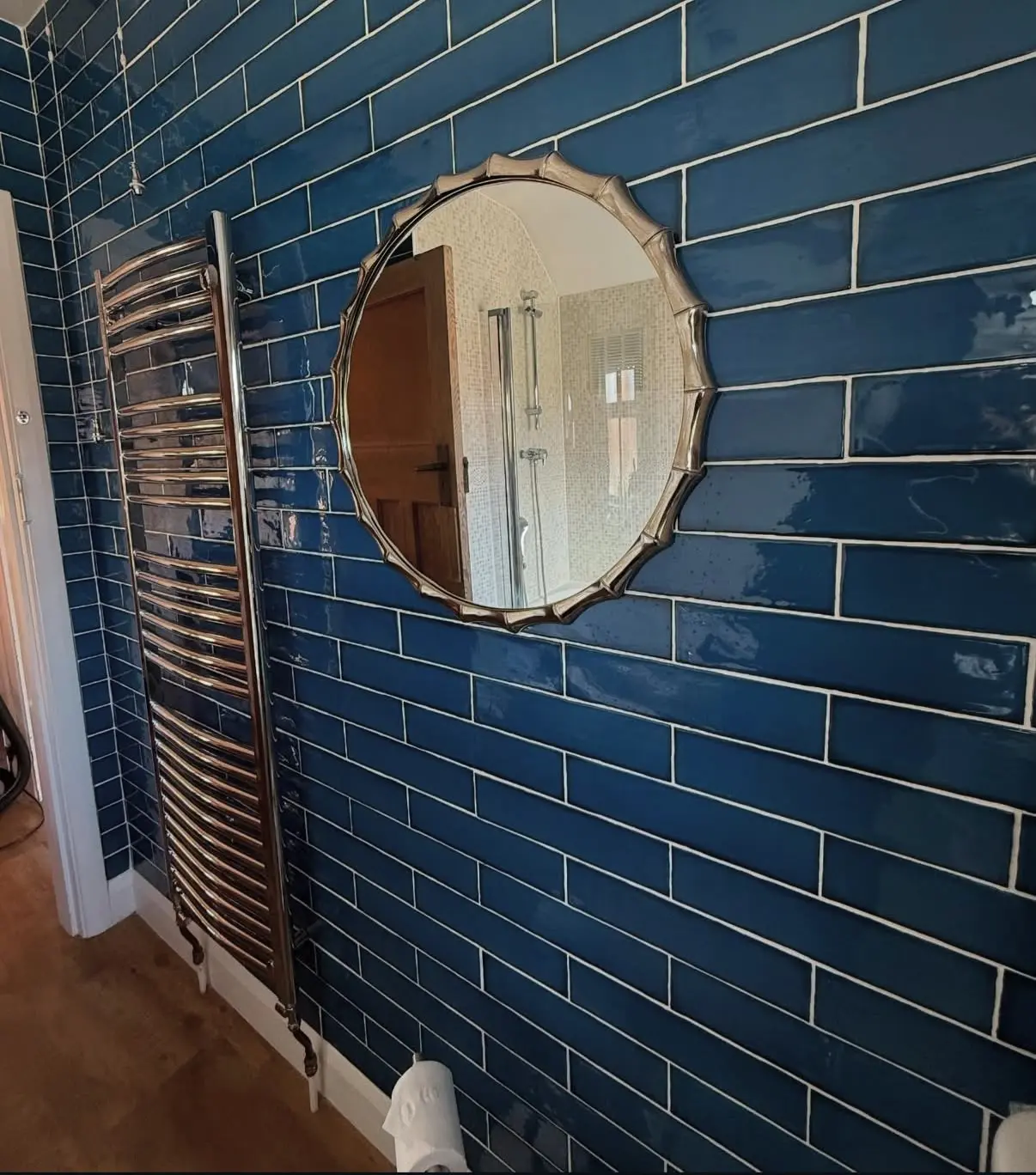 Blue tiled bathroom before detailed cleaning