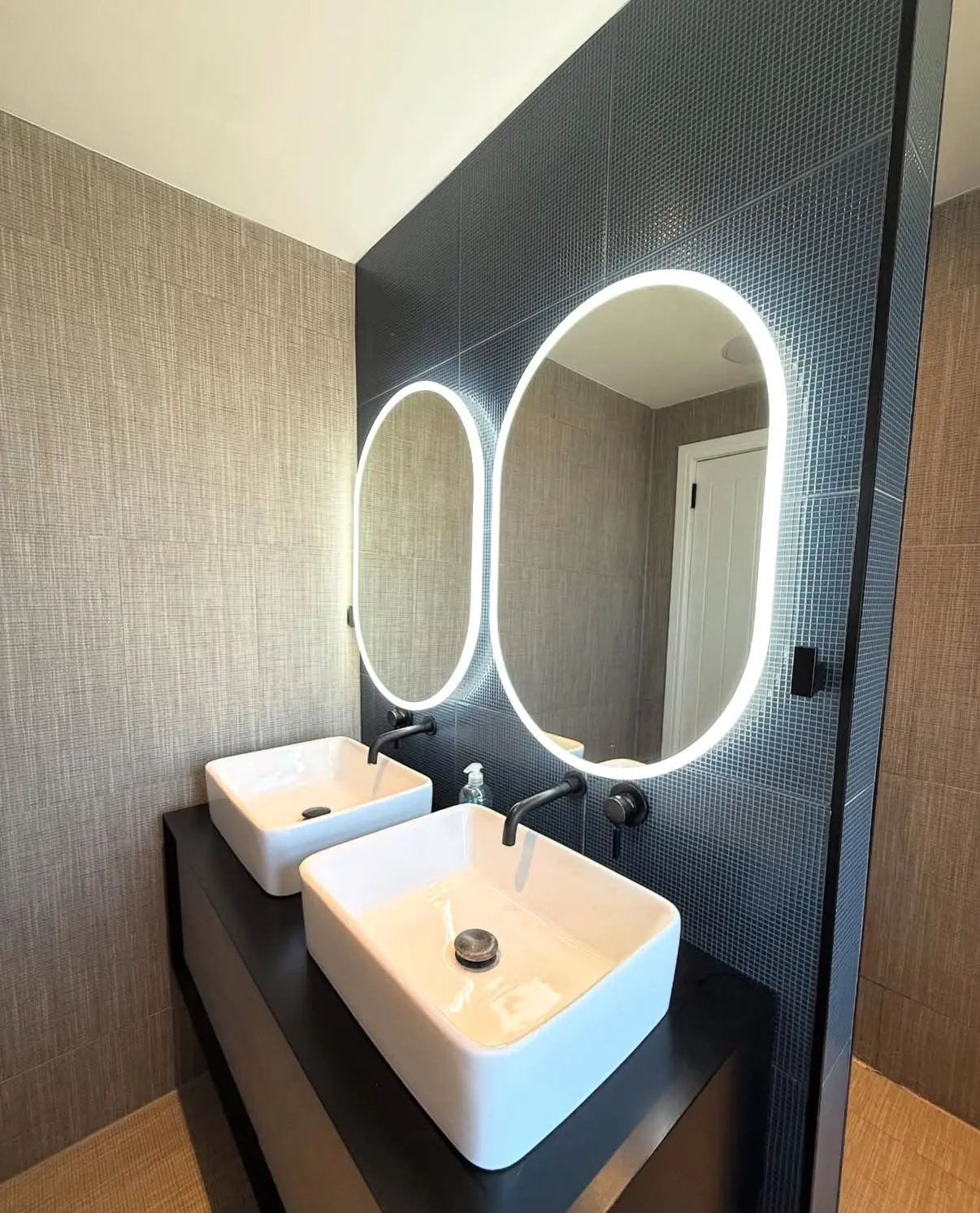 Illuminated bathroom mirrors after cleaning